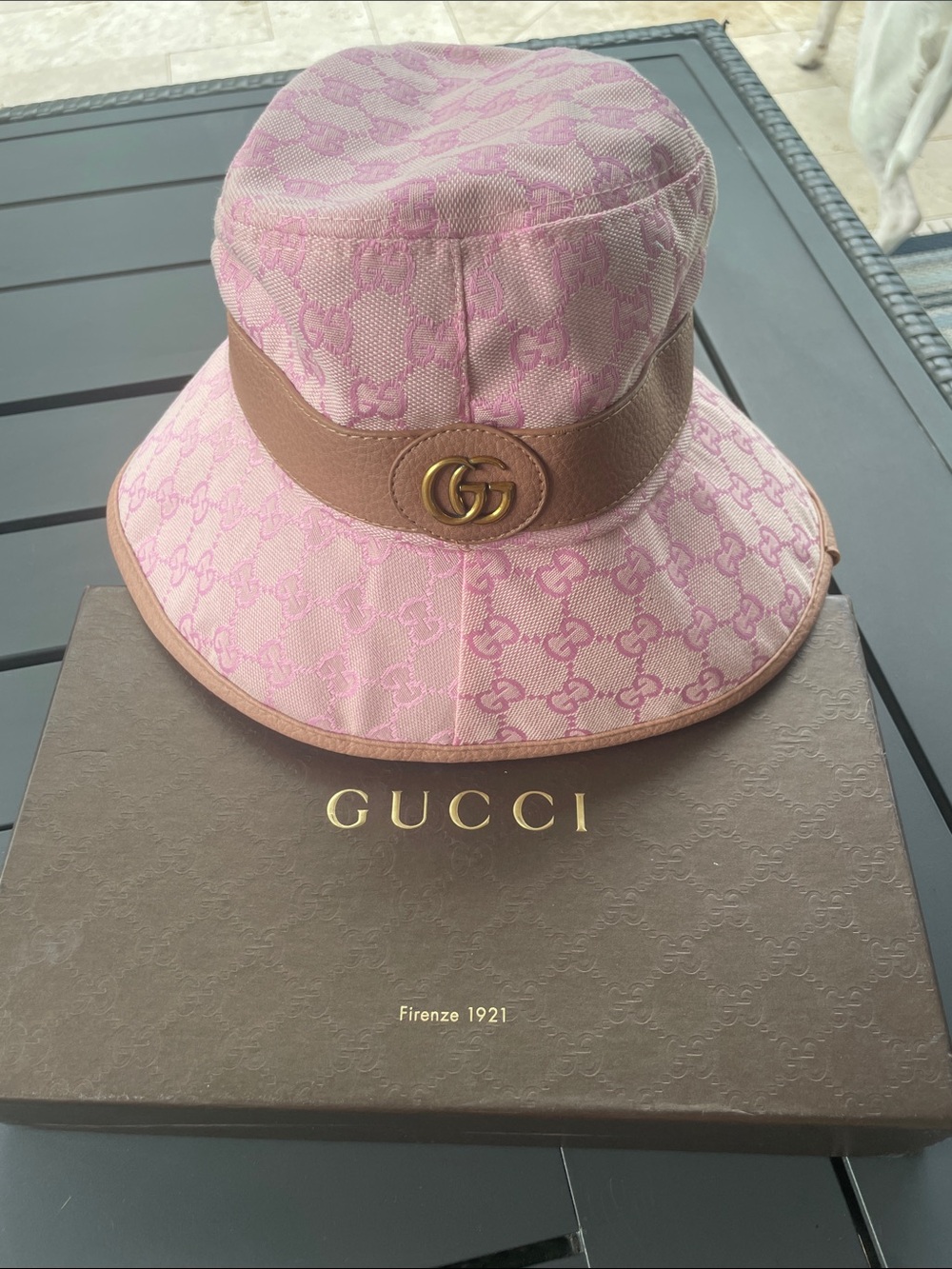 Pink Monogram bucket hat with gold hardware.